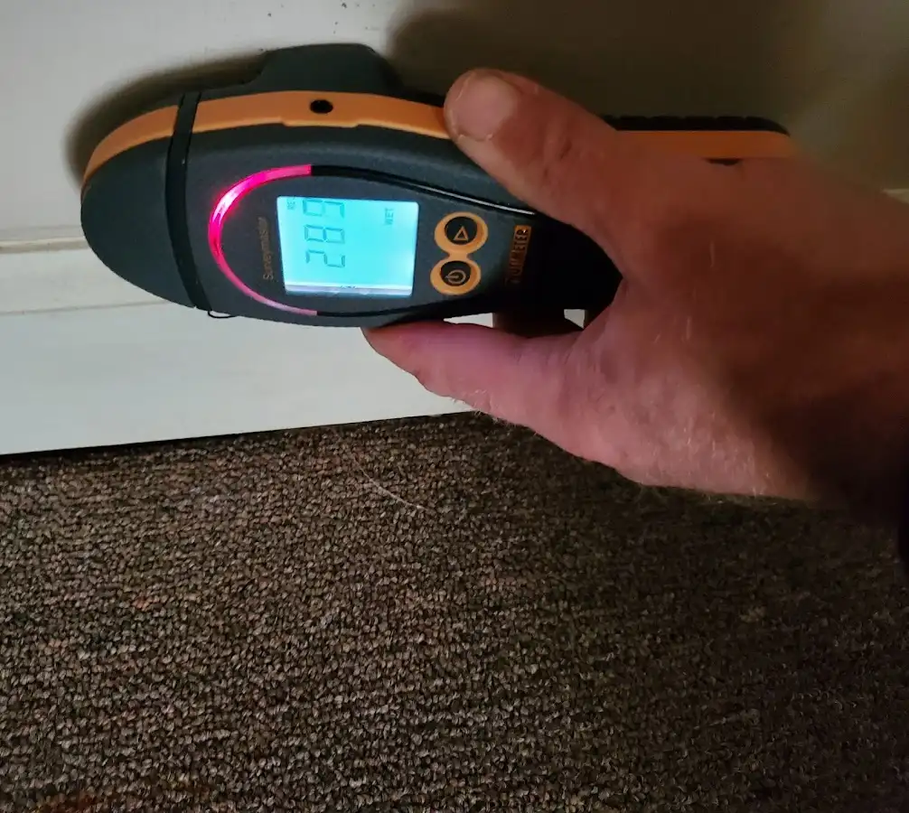 Moisture detection at baseboard during Storm Damage Restoration in Oroville